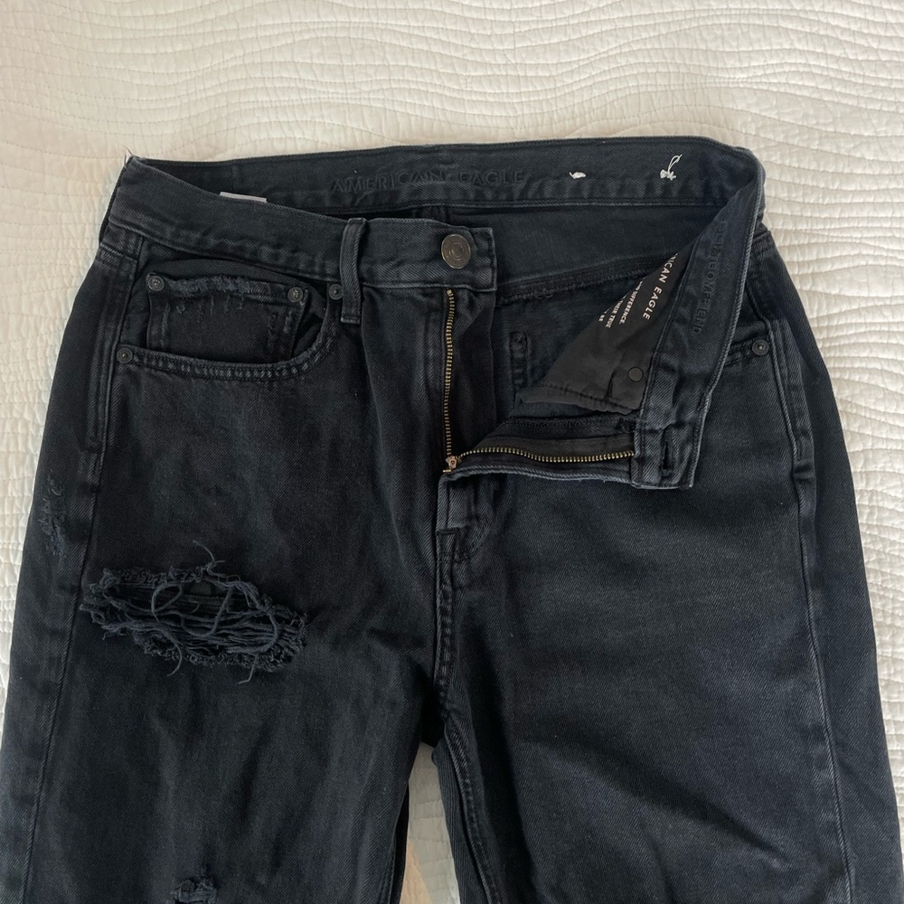 Distressed black American eagle jeans